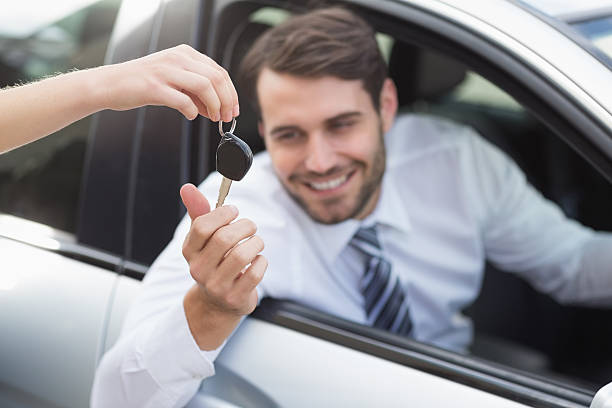 istock Businessman getting his new car key 468796832