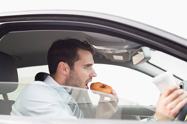 istock Young businessman having coffee and doughnut 468798954