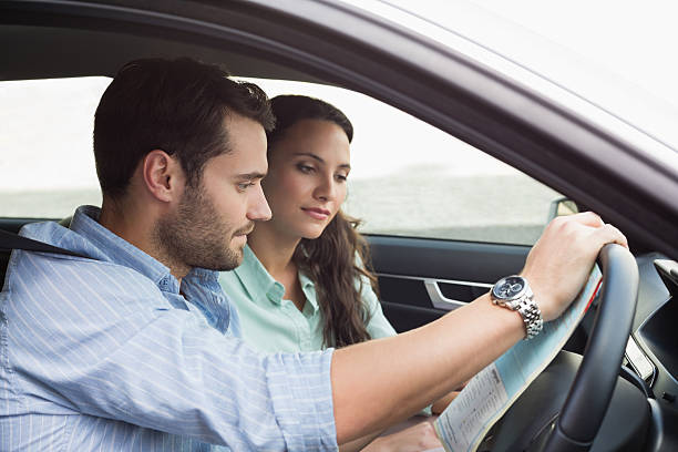 istock Young couple looking at the map 468799292