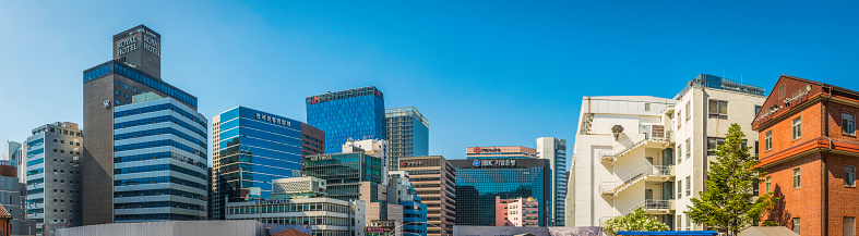 Panoramic view across the crowded cityscape, skyscrapers and highrises of downtown Seoul, South Korea's vibrant capital city. ProPhoto RGB profile for maximum color fidelity and gamut.