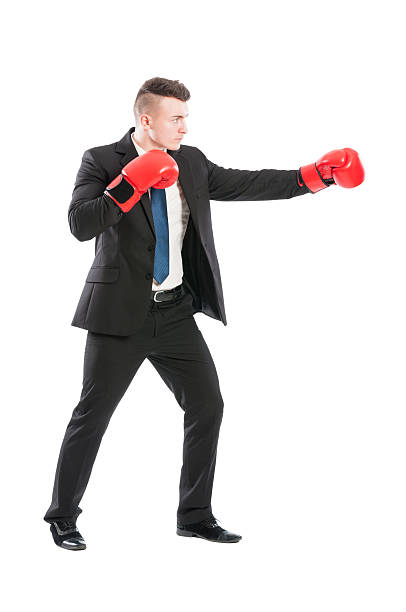 istock Successful business man fighting like a boxer 468800848