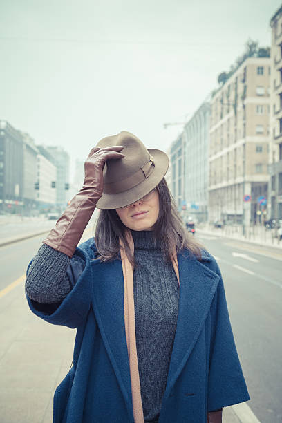 istock Beautiful young brunette posing in the city streets 468801408