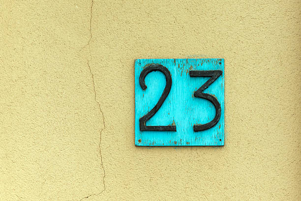 istock Number 23 on wall background, vintage style. 468801424
