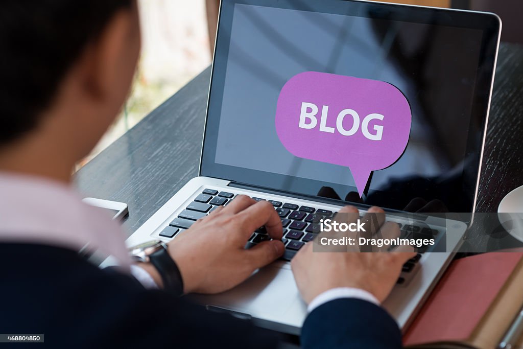 Blogging man Blogging man, view over the shoulder 2015 Stock Photo