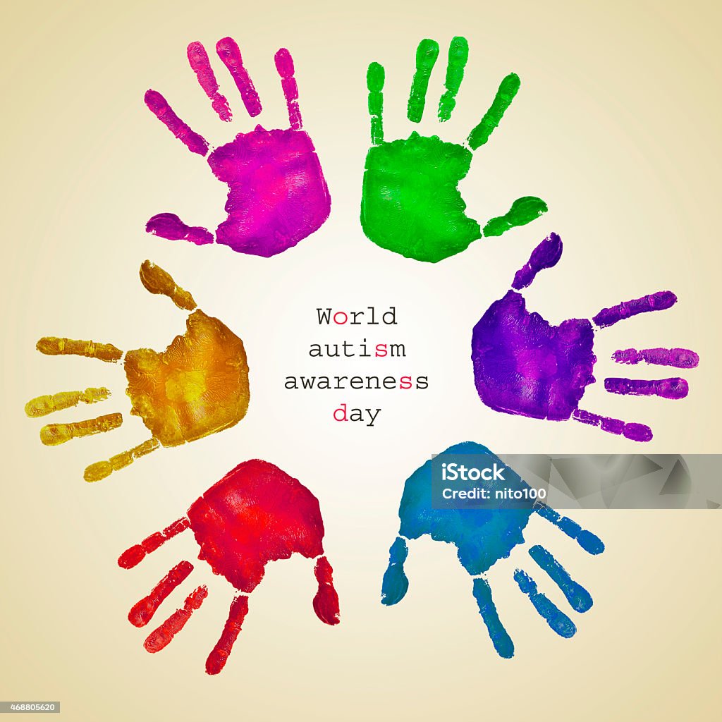 handprints of different colors and text world autism awareness d some handprints of different colors forming a circle on a beige background and the text world autism awareness day written inside World Autism Awareness Day Stock Photo