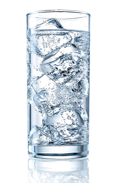 Glass of mineral carbonated water with ice Glass of mineral carbonated water with ice carbonated water photos stock pictures, royalty-free photos & images