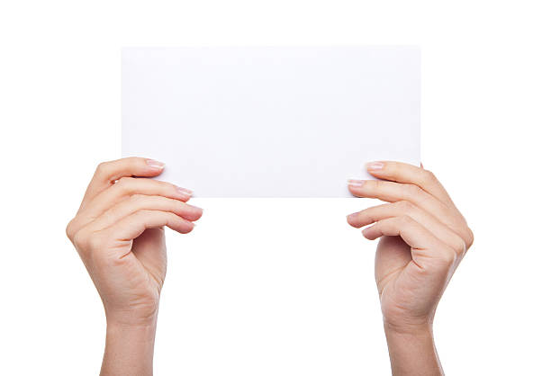 istock hand holding blank paper isolated 468808624