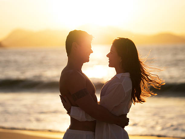 istock Romantic couple enjoying on the beach at sunset. 468808692