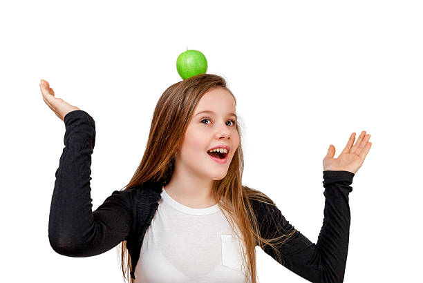 istock Little girl with apple 468808928