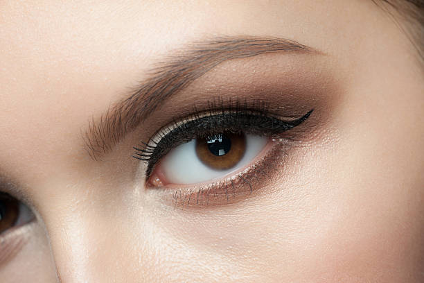 istock Close-up of a woman's face with elegant eye makeup 468811471