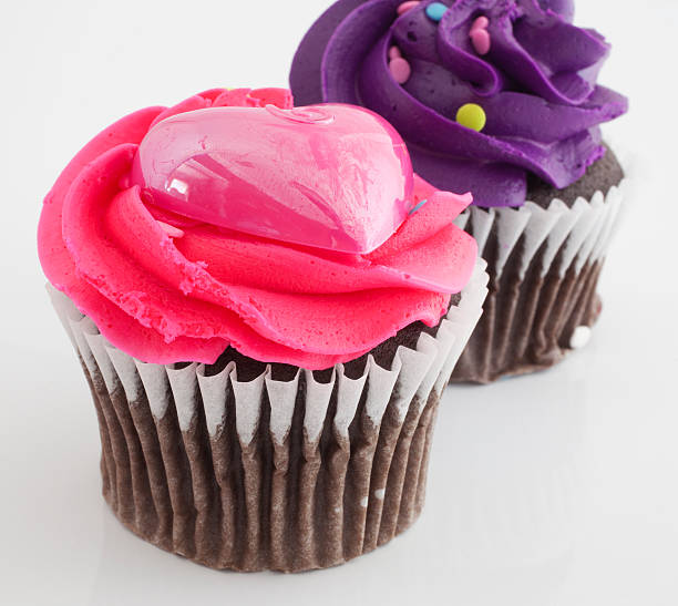 istock Pink and purple frosted cupcakes 468811996