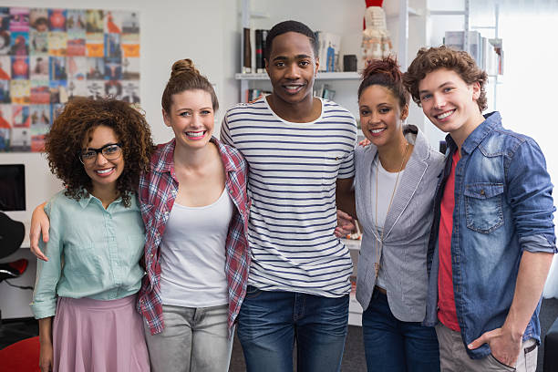 istock Fashion students smiling at camera together 468812682