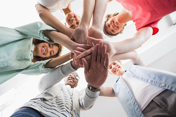 istock Fashion students putting hands together 468812876