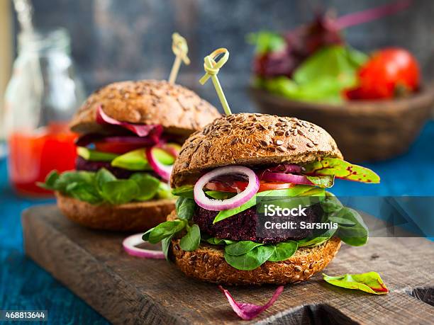 Veggie Beet And Quinoa Burger With Avocado Stock Photo - Download Image Now - Burger, Vegan Food, Gourmet