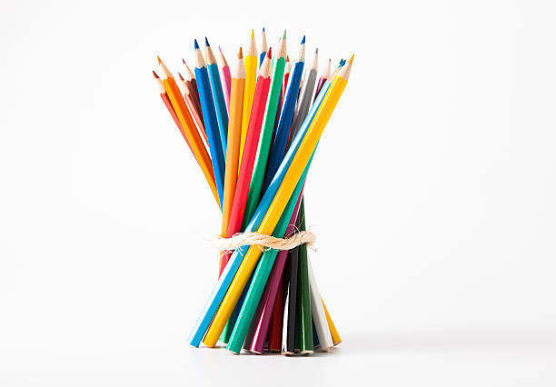 Colored Pencils Group in Spiral. Close-up. Concept. Isolated on White Background.