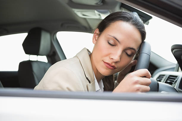 istock Businesswoman sleeping on the wheel 468814062