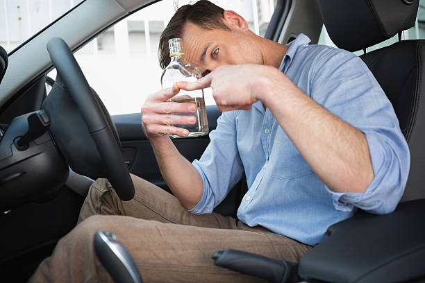 istock Man showing an empty bottle of vodka 468814148