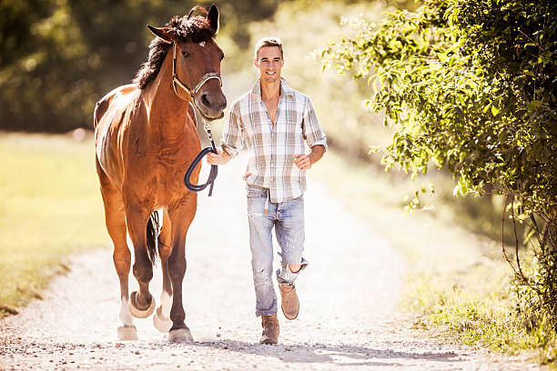 istock Man running with a horse. 468814284