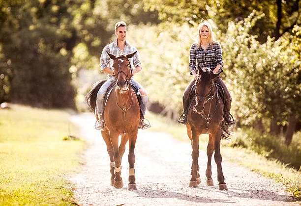 istock Young couple riding horses in nature. 468816334