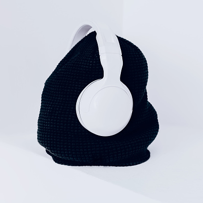 Trendy urban style. Black and white combination. fashion accessories. Headphones and hat