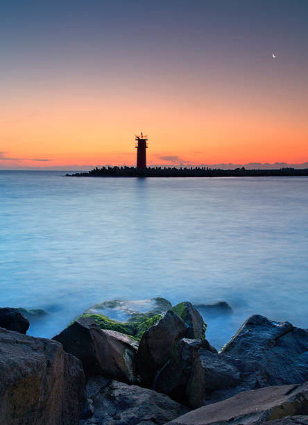istock Seascape at sunset - lighthouse on the coast 468817488