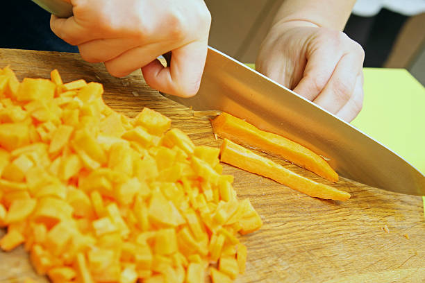 istock cutting fresh carrot on the cutting board 468817538