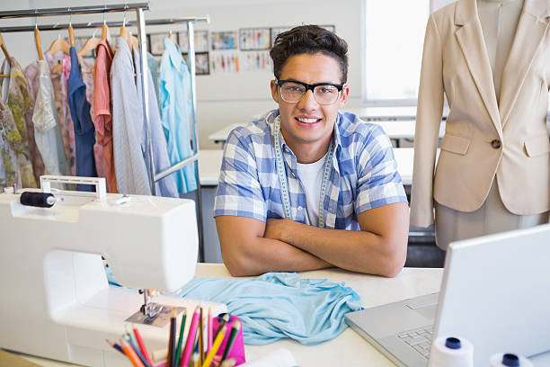 istock College student sitting with sewing machine and laptop 468817908