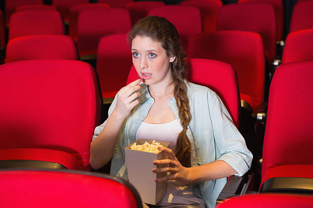 istock Young woman watching a film 468818542