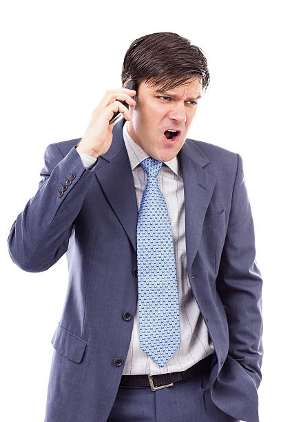 istock Angry businessman speaking on mobile phone and shouting 468818645