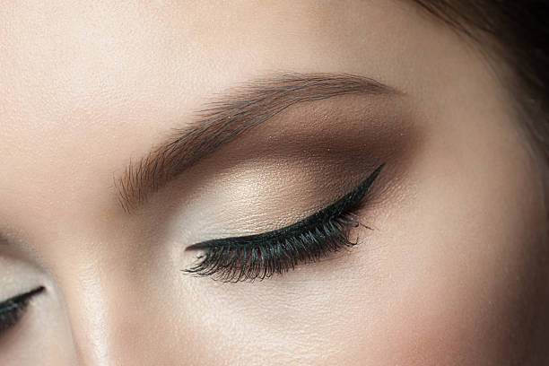 Eye Makeup Closeup of beautiful woman eye with makeup, closed eyes eyeliner stock pictures, royalty-free photos & images