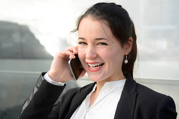 istock Successful young business woman using smart phone, Berlin, Germany 468818938
