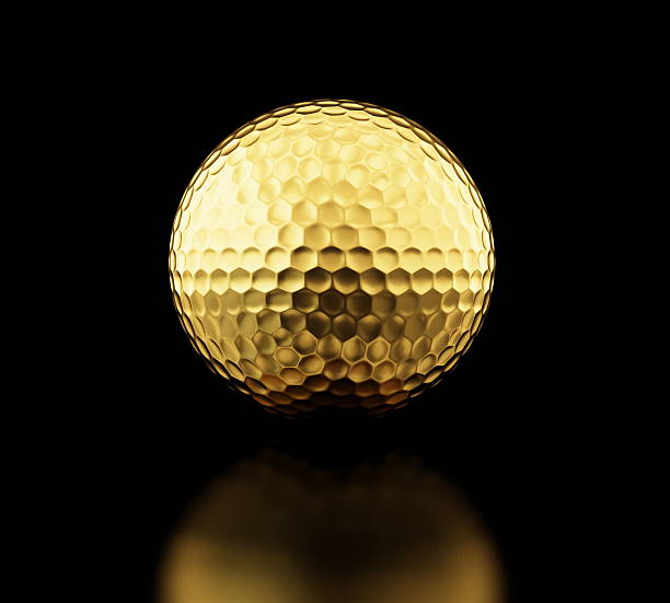 istock gold golf ball on black background 468820927