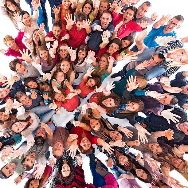 istock Large group of cheerful people with raised hands. 468823072