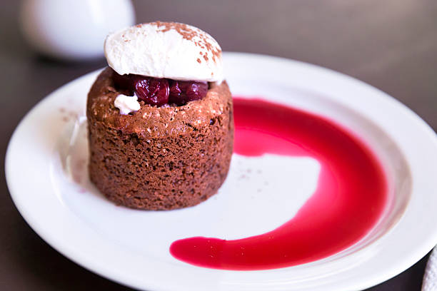 istock Dessert with chocolate sponge cake, cherry and vanilla ice cream 468828100