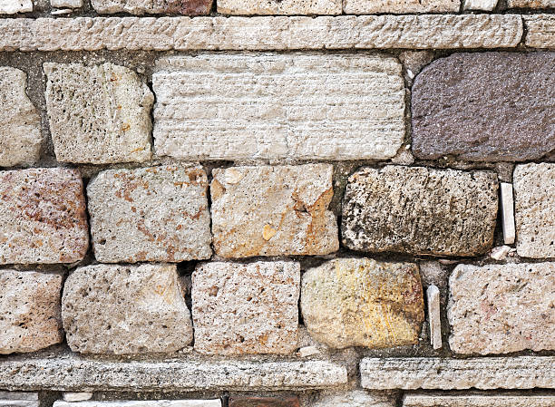 istock Old wall made of brown stones, background texture 468829150