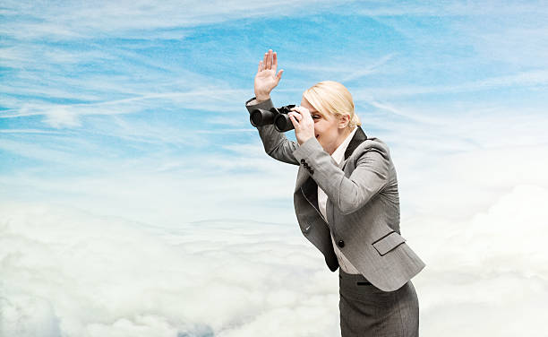 istock Businesswoman searching with binocular 468829172