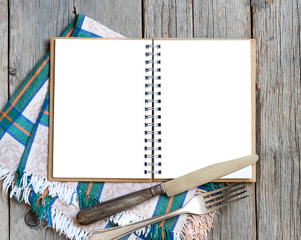 istock Blank cooking recipe book on wooden table 468829296