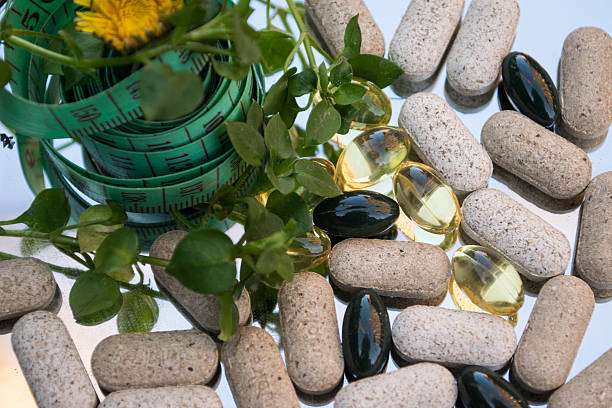 istock Natural supplements and measuring tape 468832492