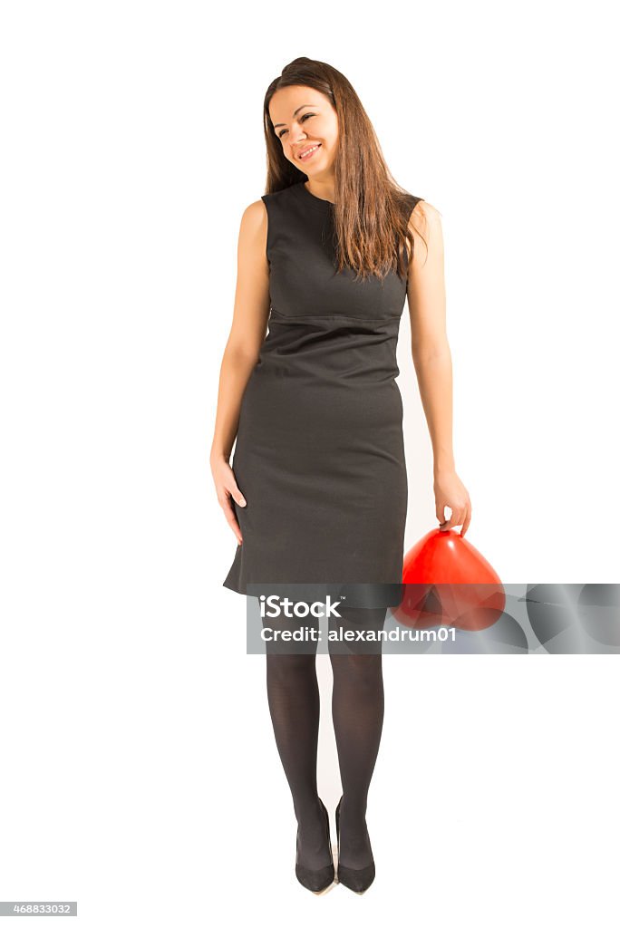 Woman with red heart balloon Woman with red heart balloon smiling,isolated on a white background. Love and valentines day. 2015 Stock Photo