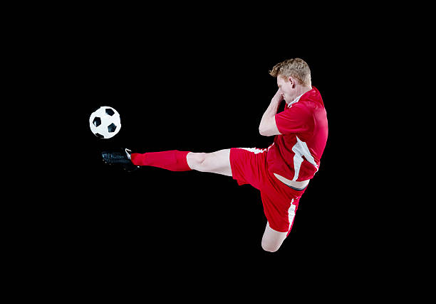 istock Male soccer player kicking the ball 468833728