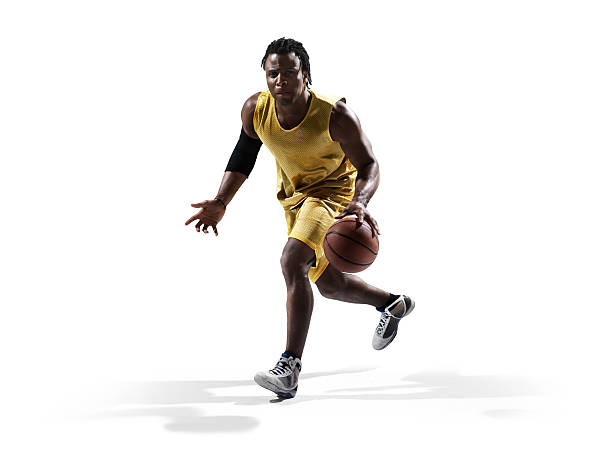 Isolated basketball player Isolated on white professional basketball player dribbling stock pictures, royalty-free photos & images