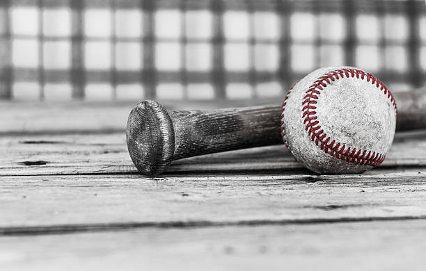 istock black and white close up image of baseball and bat 468837336