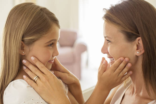 istock Mother and daughter touching faces 468837665