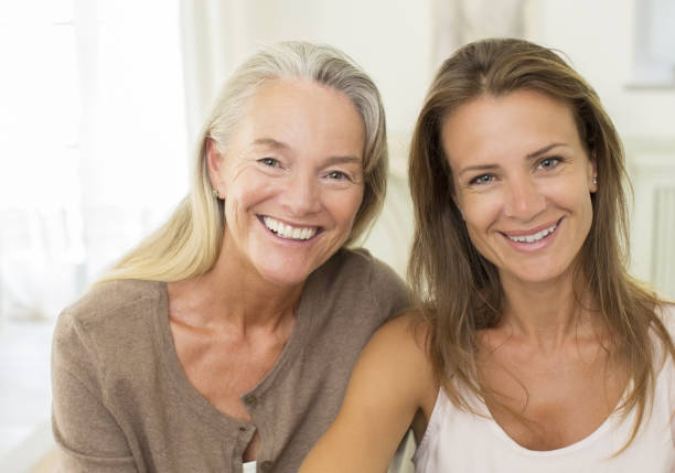 istock Mother and daughter smiling indoors 468837841