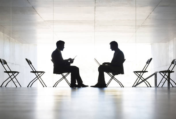 istock Silhouette of businessmen working in office 468837977