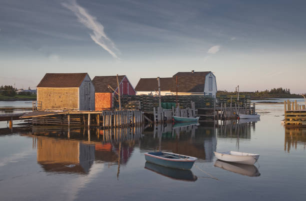 istock Rowboats and buildings on calm bay 468838175