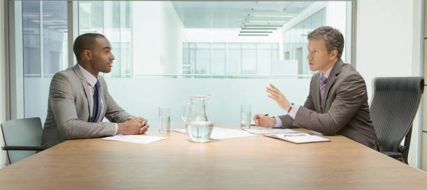Businessmen talking in meeting  english spoken stock pictures, royalty-free photos & images