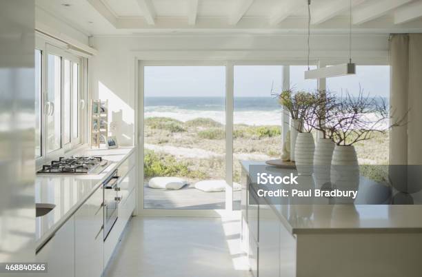Modern White Kitchen With Ocean View Stock Photo - Download Image Now - Home Interior, Domestic Life, Beach