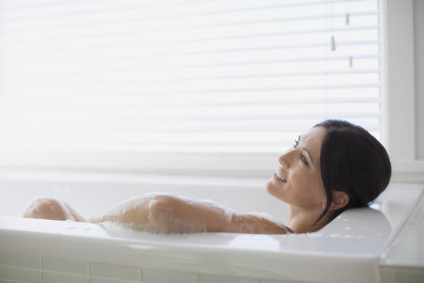istock Woman relaxing in bubble bath 468840665