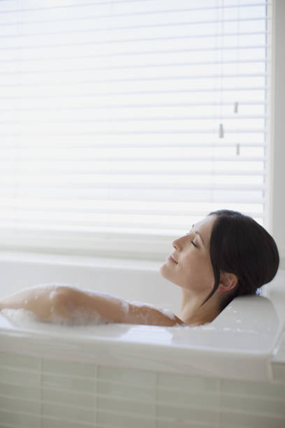 istock Woman relaxing in bubble bath 468840679